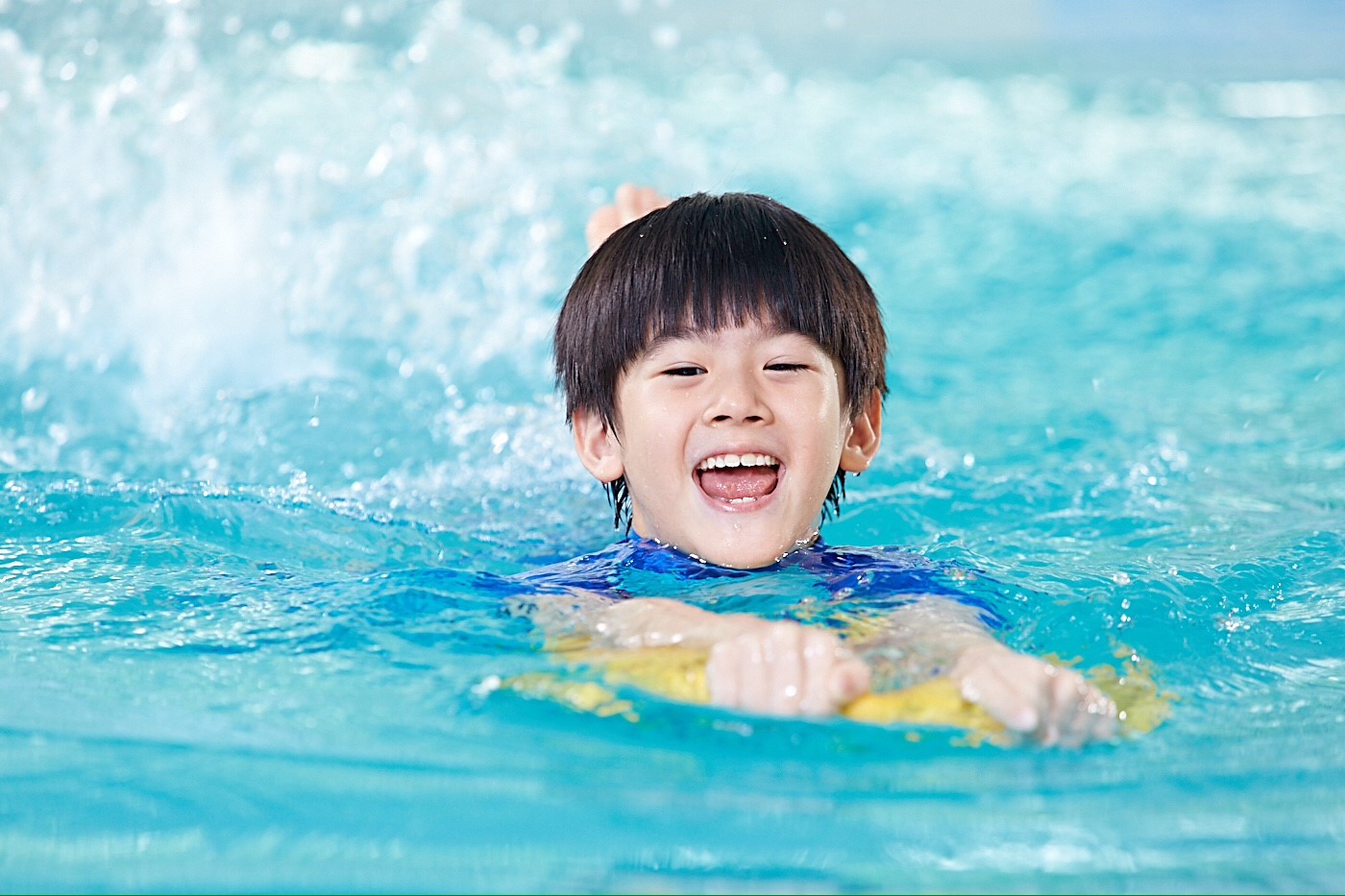 6 years old boy swimming