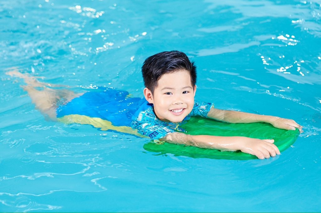 Boy learning swimming in bangkok